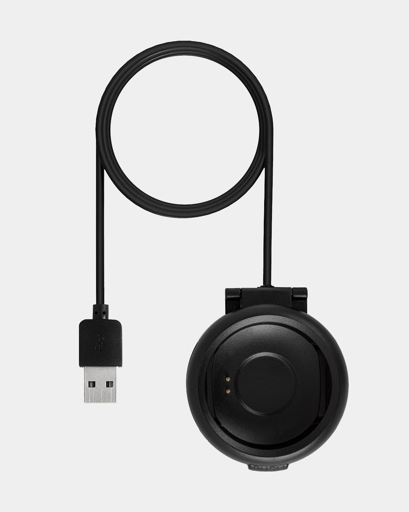 A black Reflex-Active Round Case Charger connected to a white surface, conveniently charging smartwatches.